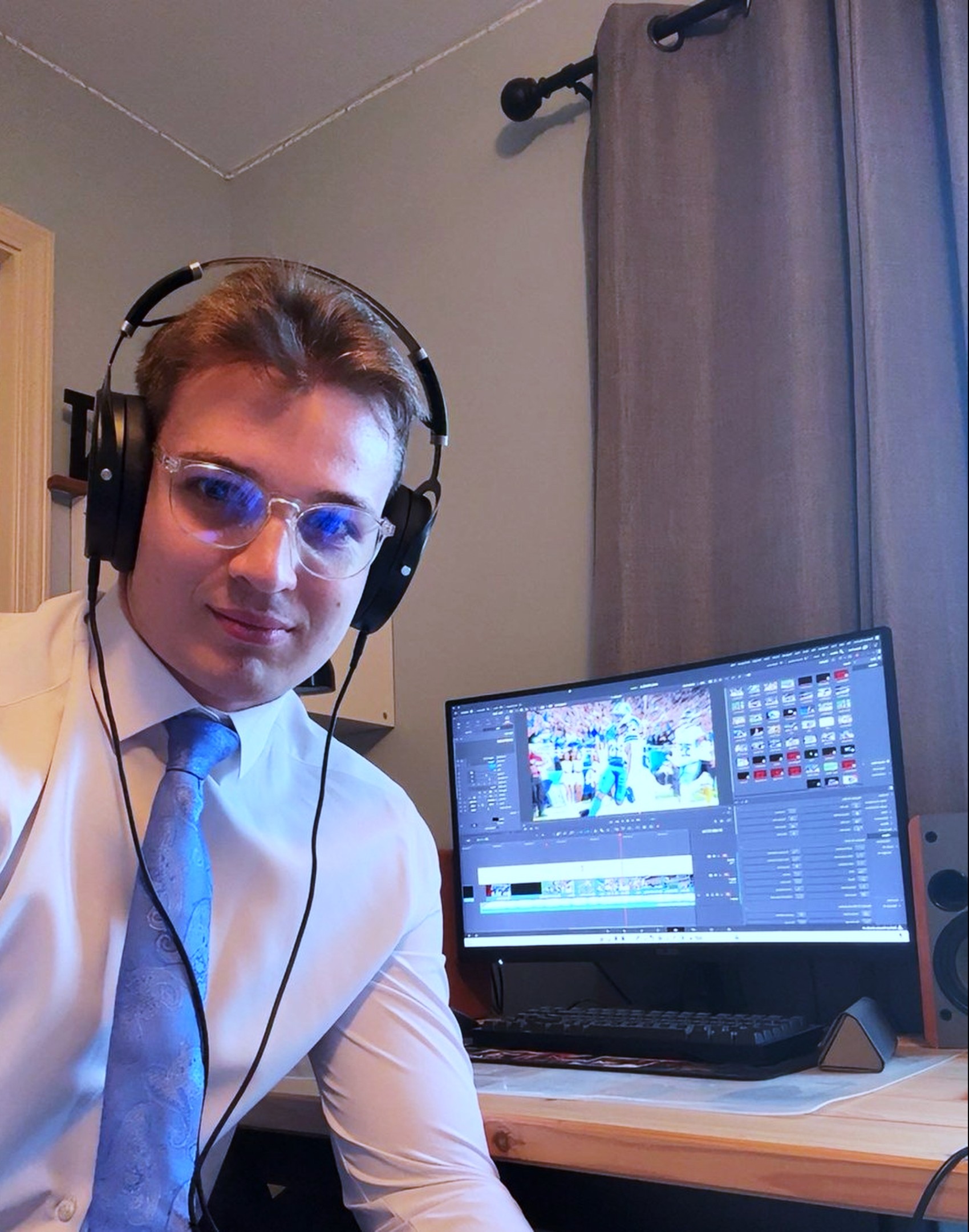 Aaron Chismar at his desk, editing a Detroit Lions play in DaVinci Resolve